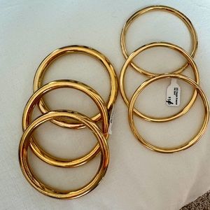NEW 2 sets of 3 gold bangles. 2 sizes, super fun for layering